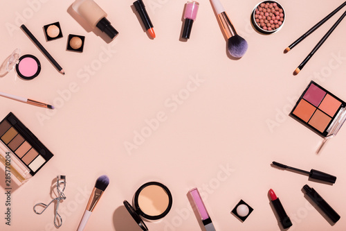 Frame of makeup professional products on pink