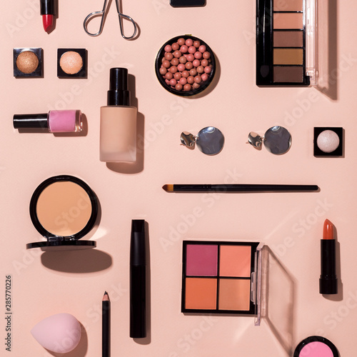 Set of colorful cosmetic for makeup on pink background