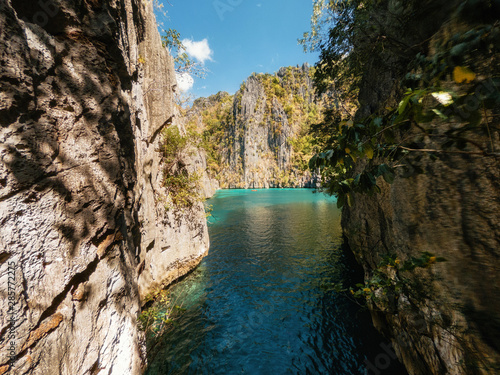 View to tropical Twin lagoon with azure water between rocks, Coron island. Palawan, Philippines.