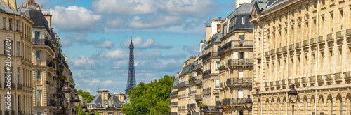 Eiffel tower between Parisian tenement old street alley and buildings © FreeProd
