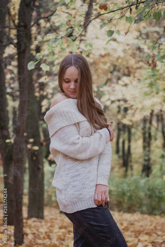 Young woman in beautiful autumn park, concept autumn. Happy mood Young woman in beautiful autumn park, concept autumn. Happy mood