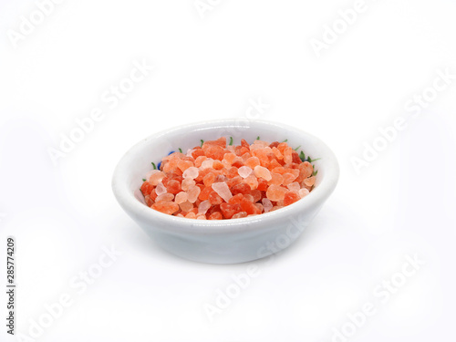 Himalaya pink salt in bowl isolated on white background.   