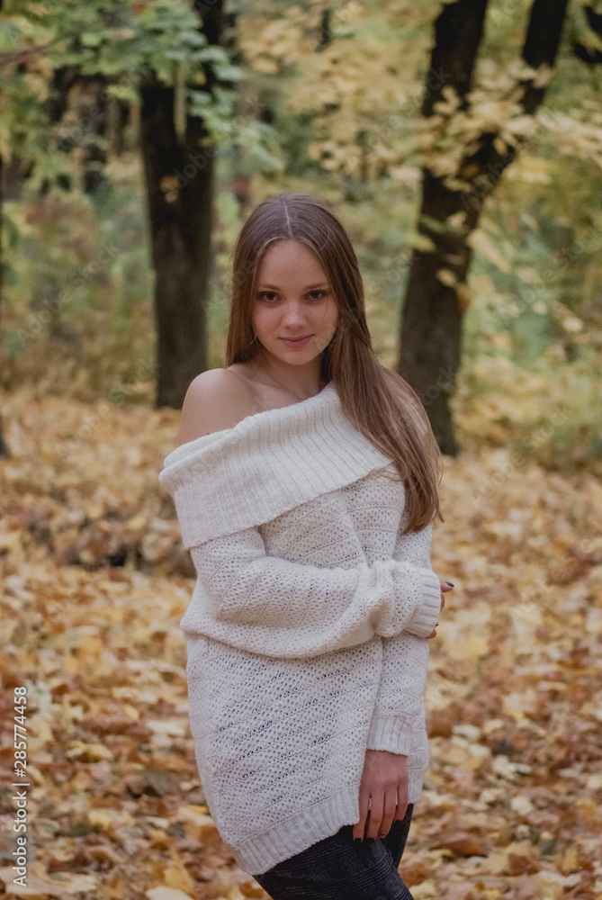 Young woman in beautiful autumn park, concept autumn. Happy mood Young woman in beautiful autumn park, concept autumn. Happy mood