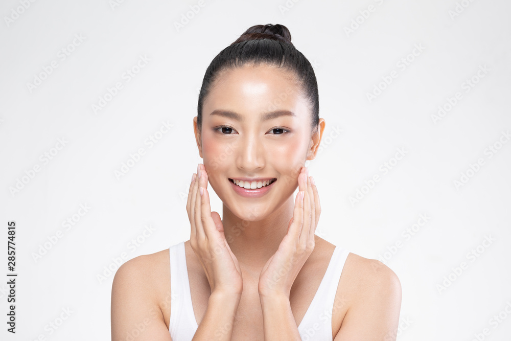 Beautiful Asian woman touching soft cheek smile with clean and fresh skin Happiness and cheerful with positive emotional,isolated on white background,Beauty and Cosmetics Concept Beautiful Asian woman touching soft cheek smile with clean and fresh skin Happiness and cheerful with positive emotional,isolated on white background,Beauty and Cosmetics Concept