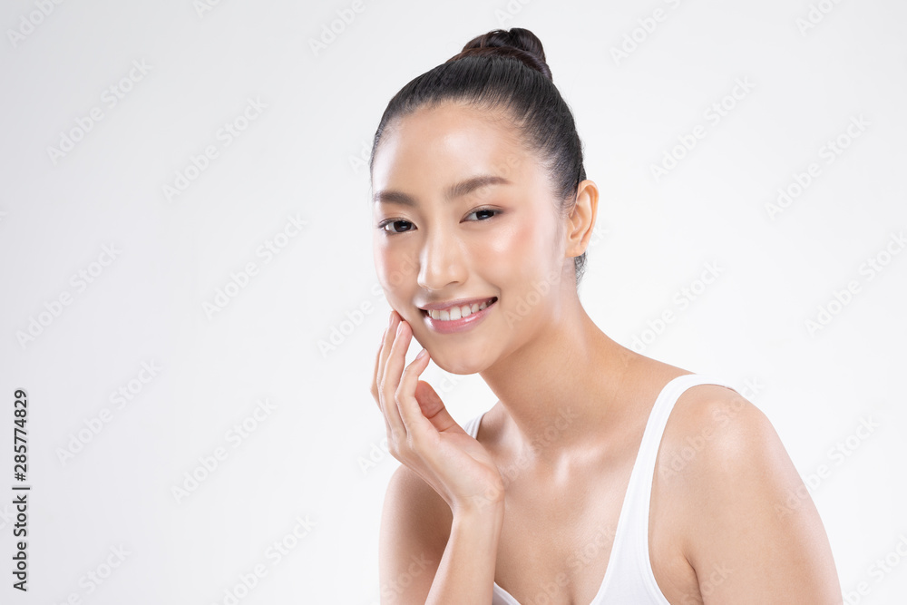 Beautiful Asian woman touching soft cheek smile with clean and fresh skin Happiness and cheerful with positive emotional,isolated on white background,Beauty and Cosmetics Concept Beautiful Asian woman touching soft cheek smile with clean and fresh skin Happiness and cheerful with positive emotional,isolated on white background,Beauty and Cosmetics Concept