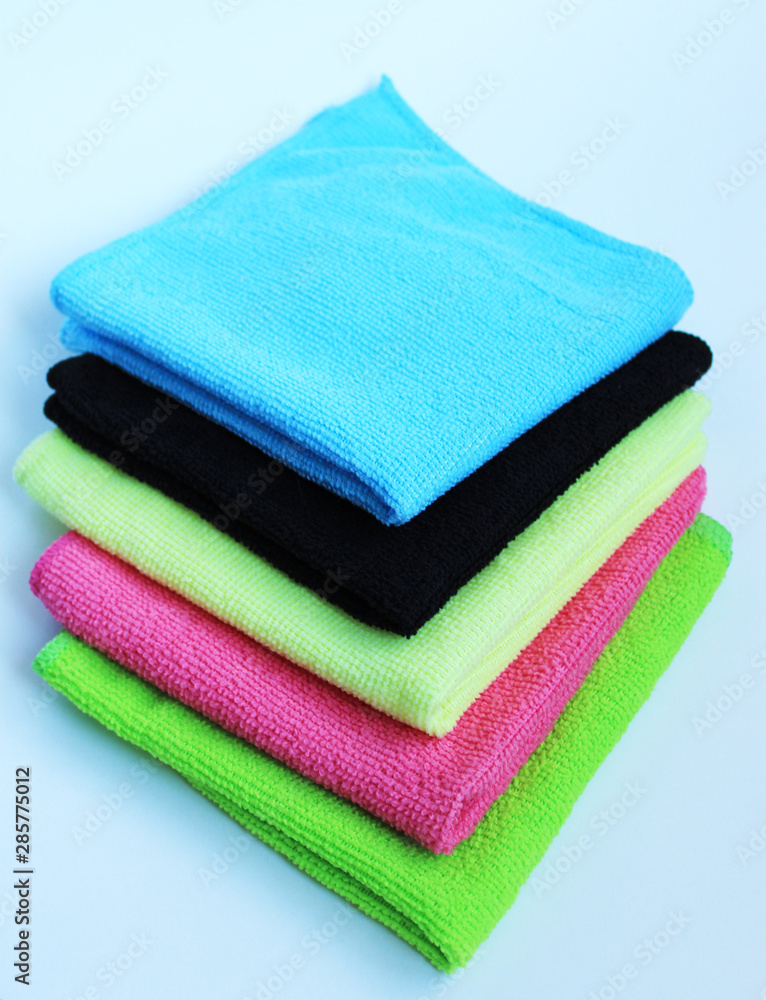 Bright multi-colored rags stacked in a stack. Bright multi-colored rags stacked in a stack.