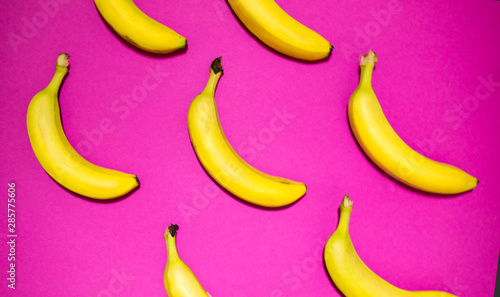 Creative layout made of Bananas on pink background. Food concept.