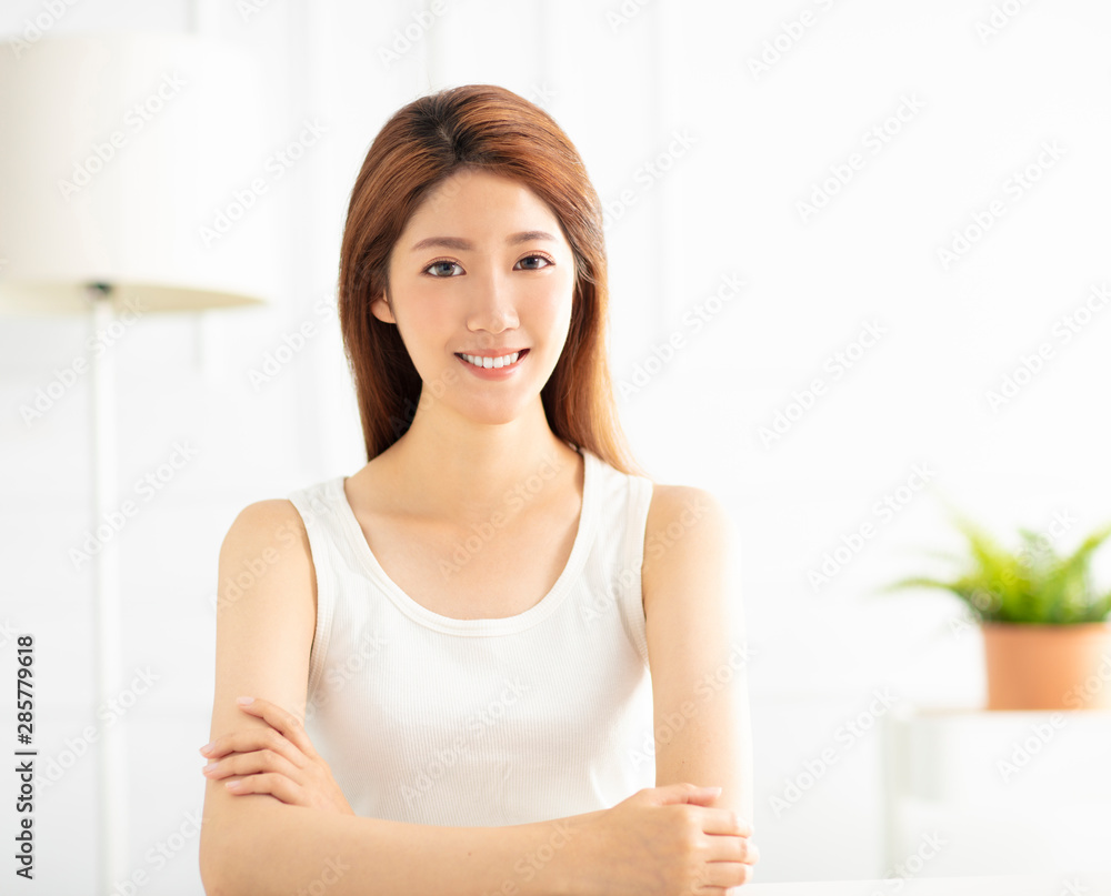 closeup smiling young asian woman in living room closeup smiling young asian woman in living room