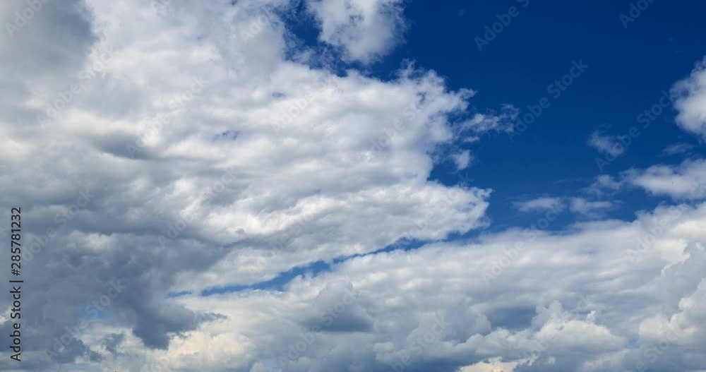 Beautiful blue sky with white clouds in motion. 4K DCI Timelapse. Dramatic heaven on a Sunny day in good weather. Natural background, nature, cloudscape. Wind energy. Beautiful blue sky with white clouds in motion. 4K DCI Timelapse. Dramatic heaven on a Sunny day in good weather. Natural background, nature, cloudscape. Wind energy.