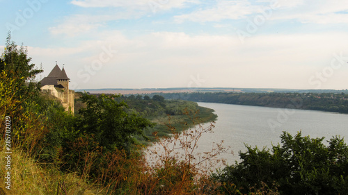 Fototapeta Naklejka Na Ścianę i Meble -  Dniester river and Khotyn fortress (fortification complex located  in Khotyn, Chernivtsi Oblast (province) of western Ukraine). 06.08.2019