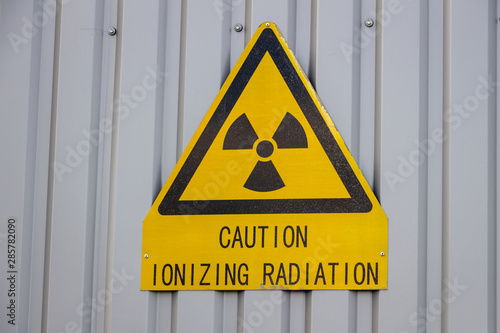 Caution ionizing radiation sign on the wall