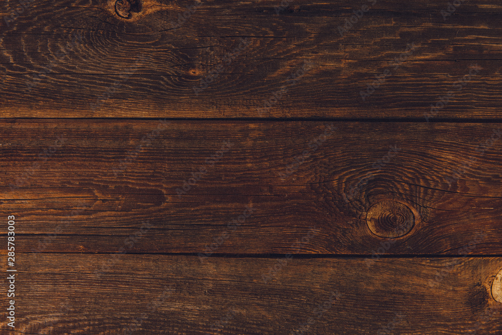 Wooden background. Texture with an old, rustic, brown planks Wooden background. Texture with an old, rustic, brown planks