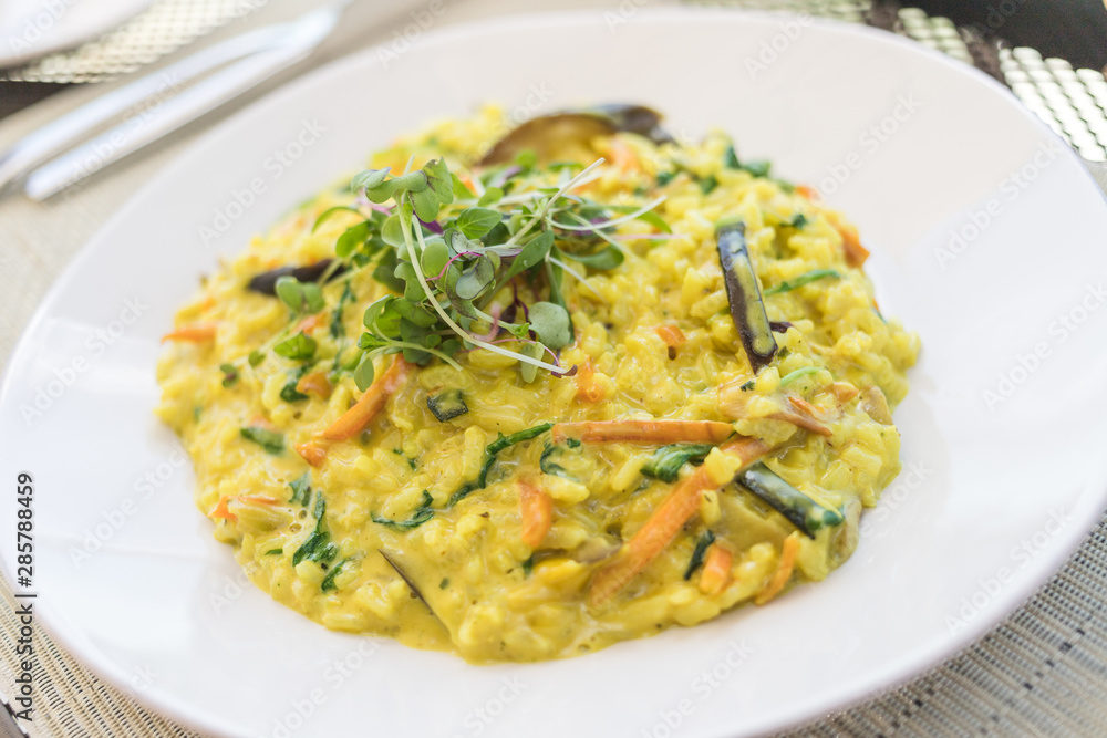 Saffron Risotto dish with carrot and watercress