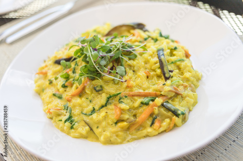 Saffron Risotto dish with carrot and watercress