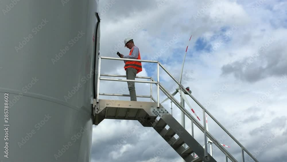 Wind Turbine Engineer Uses Tablet Zoom Wind Turbine Engineer Uses Tablet Zoom