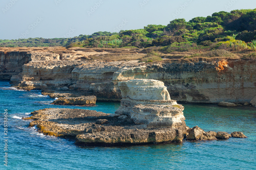 Torre Sant Andrea, Rocky beach in Puglia, Italy. Salento sea coast, cliffs in the clear adriatic sea