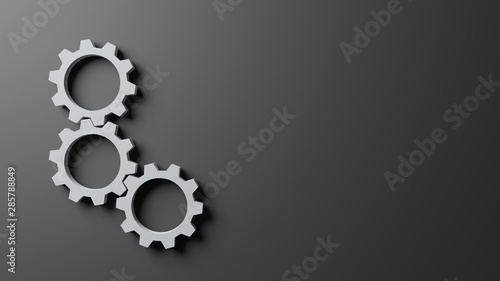 3D computer generated image of three connecting gear on dark gray background, copy space, wallpaper design