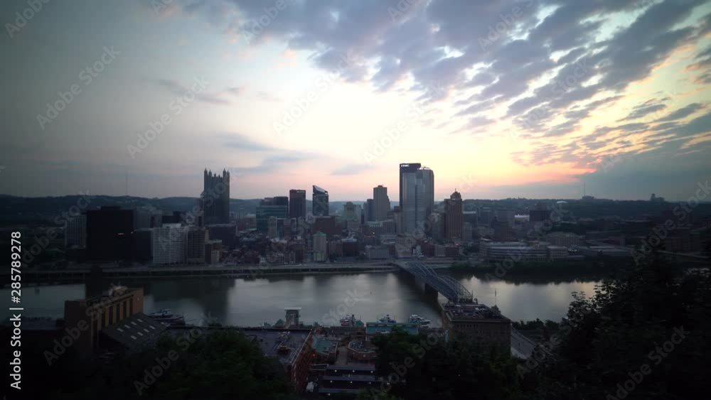Beautiful panning view at sunrise of the downtown area of Pittsburgh Pennsylvania in the summer. Beautiful panning view at sunrise of the downtown area of Pittsburgh Pennsylvania in the summer.
