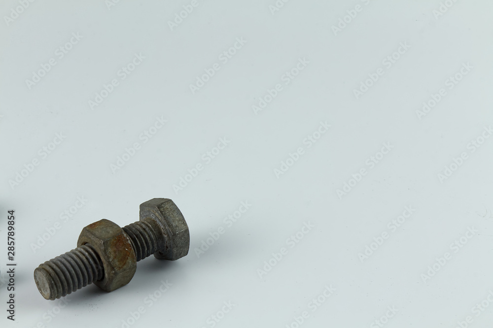 bolt and nut on blue background bolt and nut on blue background