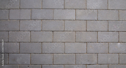 Gray rectangular paving slabs. Texture.