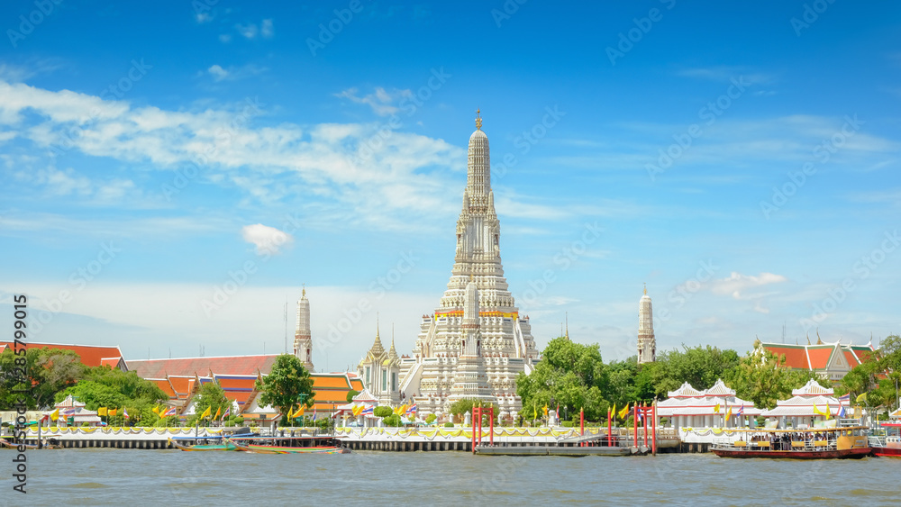 Fototapeta premium Wat arun, Boat traffic in the Chao Phraya River and in the city center, Bangkok city view of chao phraya river major river in Thailand.
