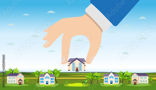 Vector of a hand picking up a house.