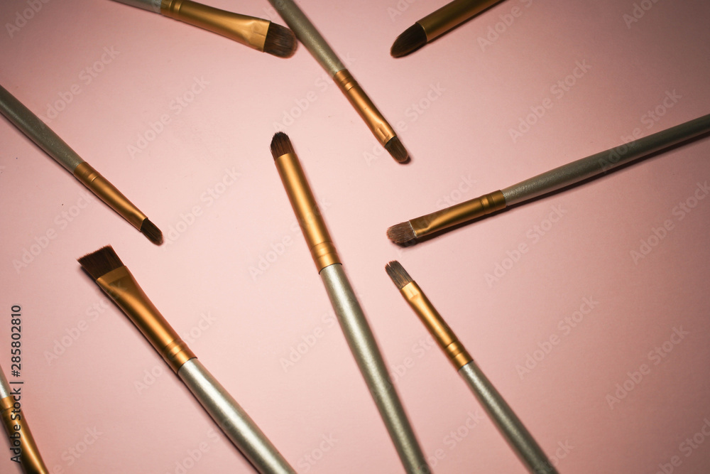 Makeup brushes on pink background Makeup brushes on pink background