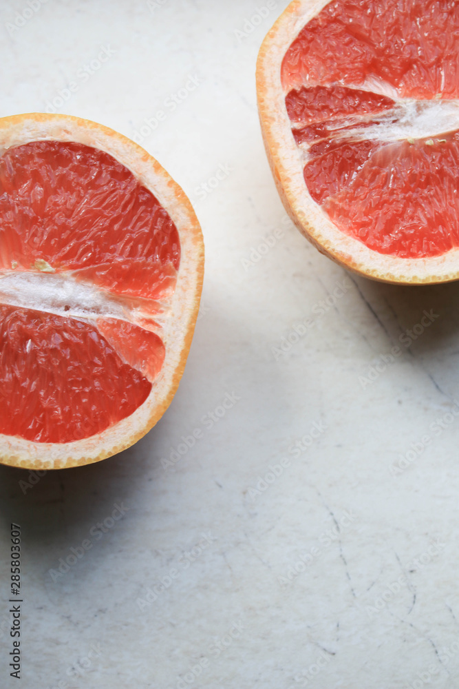 Grapefruit is cut in half Grapefruit is cut in half