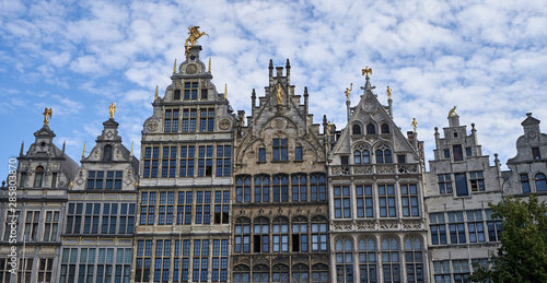 Old historic houses in Antwerp Belgium With golden statues.