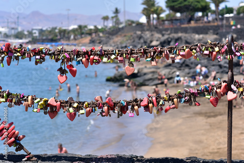 Love locks along the sea front in Playa Blanca Lanzarote, Canary Islands, Spain