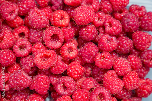 Raspberry texture background. Red ripe fresh berries. Gardening. Harvesting.