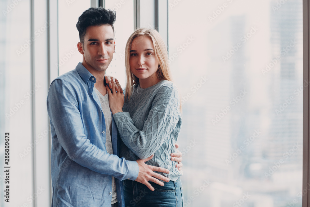Happy young couple. Positive man and woman portrait. Hug and happy in new house appartment Happy young couple. Positive man and woman portrait. Hug and happy in new house appartment