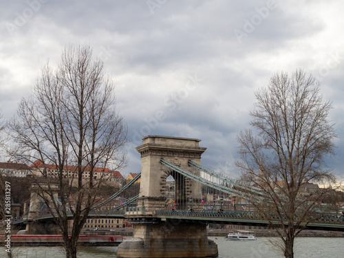 Budapest, Hungary - Mar 9th 2019: The Széchenyi Chain Bridge is a suspension bridge that spans the River Danube between Buda and Pest, the western and eastern sides of Budapest, the capital of Hungary © Keerathi