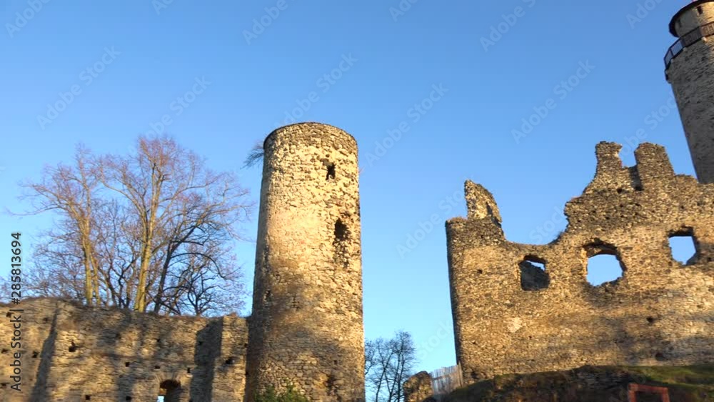 Ruins of an old castle in a rural area on a sunny day - view from below Ruins of an old castle in a rural area on a sunny day - view from below