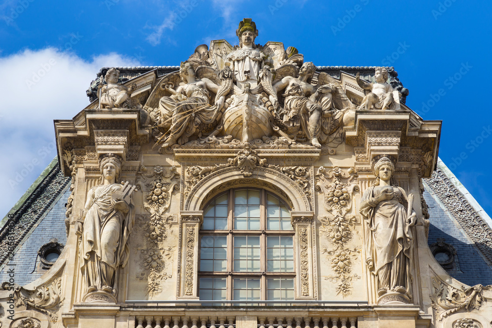 Gable of the Pavillon Turgot of the Louvre in Paris, France. Is the world's largest art museum and is housed in the Louvre Palace, originally built in the late 12th to 13th century.