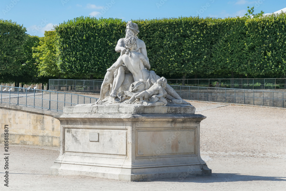 View of the marble sculpture Seine and Marne (copy of the sculpture 1712 by Nicolas Coustou (1658-1733) in the Tuileries Park, Paris, France.