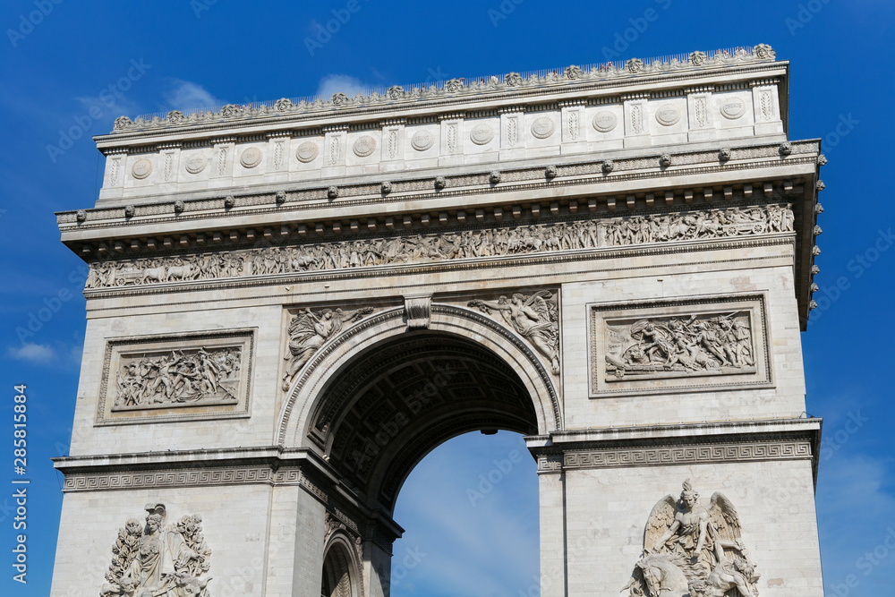 View of the famous Triumphal Arch in Paris, France. The Arc de Triomphe honours those who fought and died for France in the French Revolutionary and Napoleonic Wars.