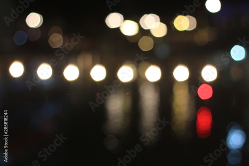 Night twilight blurred bokeh floating market water front, abstract background © Peerapong