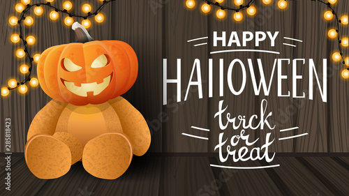 Happy Halloween, trick or treat, modern horizontal greeting postcard with wooden texture, garland and Teddy bear with Jack pumpkin head