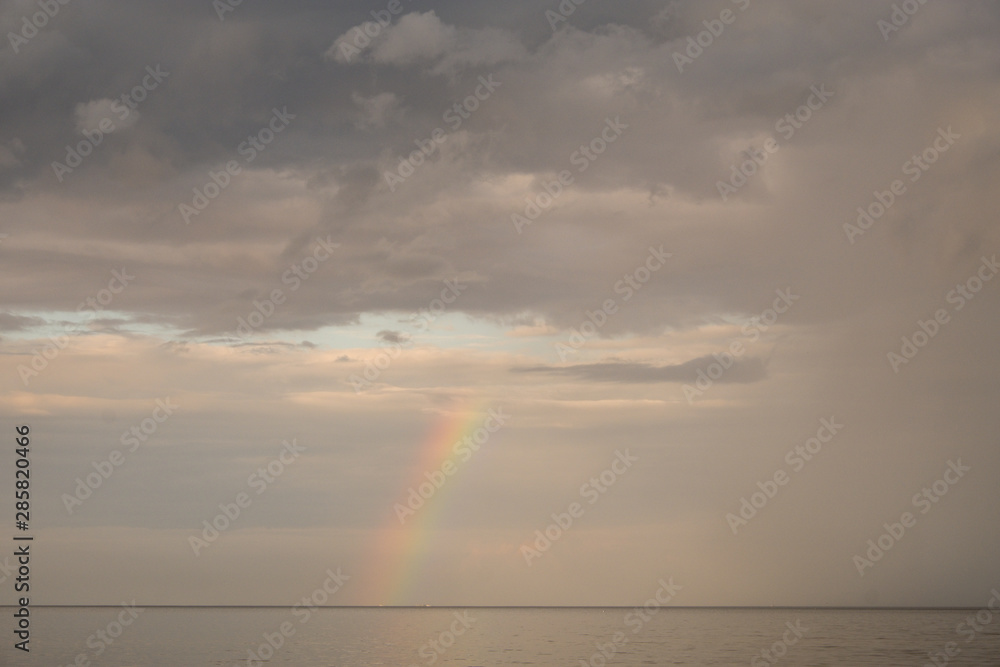 Rainbow against the sky. Seascape in the evening. It's a nasty day. Summer.