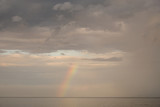 Rainbow against the sky. Seascape in the evening. It's a nasty day. Summer.
