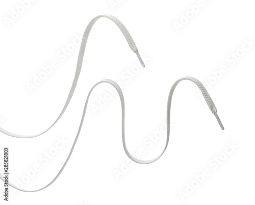 Obraz na płótnie two long white textile shoelaces, isolated on white background w salonie