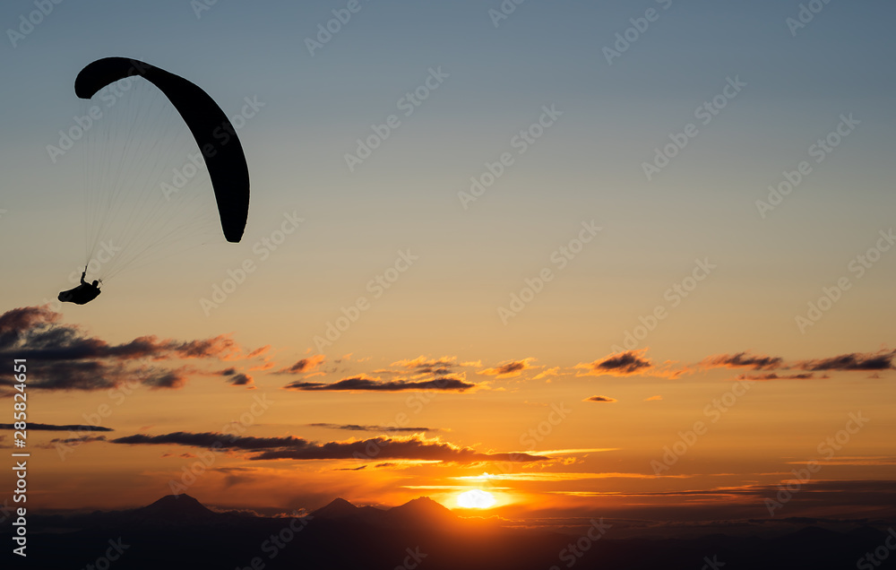 Silhouette of Paraglider at Sunset