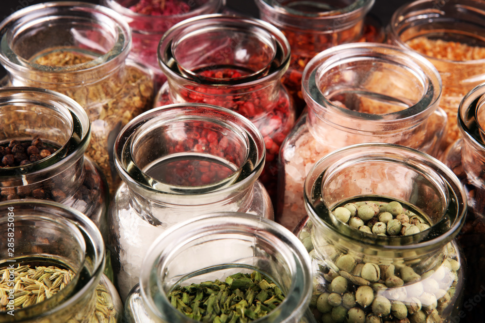 assortment of spices in glass on table. Food and cuisine ingredients and peppers assortment of spices in glass on table. Food and cuisine ingredients and peppers
