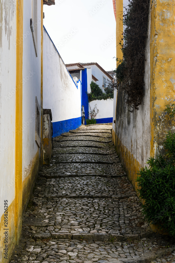 Narrow streets and white houses of old town, Obidos, Portugal Narrow streets and white houses of old town, Obidos, Portugal