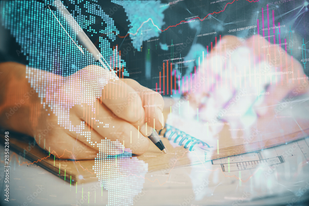 Forex chart displayed on woman's hand taking notes background. Concept of research. Double exposure Forex chart displayed on woman's hand taking notes background. Concept of research. Double exposure