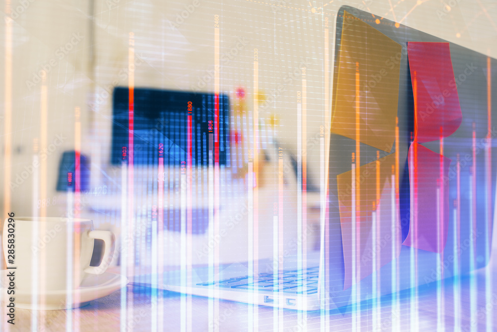 Forex market chart hologram and personal computer background. Double exposure. Concept of investment. Forex market chart hologram and personal computer background. Double exposure. Concept of investment.