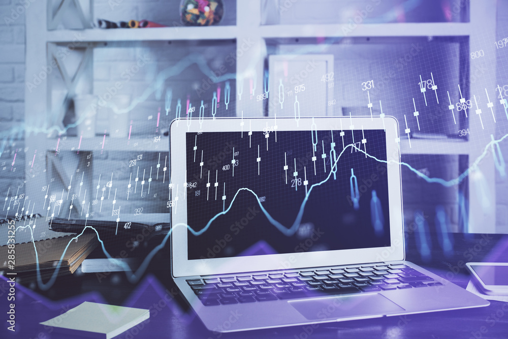Forex market chart hologram and personal computer background. Multi exposure. Concept of investment. Forex market chart hologram and personal computer background. Multi exposure. Concept of investment.