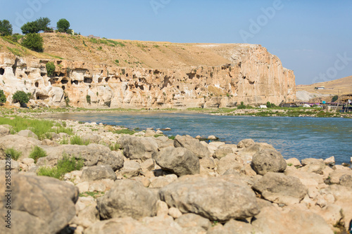 The view of the Tigris River and surrounding ancient cave houses in the town of Hasankeyf, Turkey, Batman Province