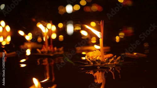Floating loy krathong and candle in Thailand full moon folk festival photo